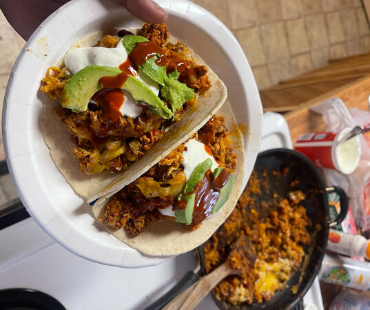 Spicy beef chorizo and potato breakfast scramble served in tortillas