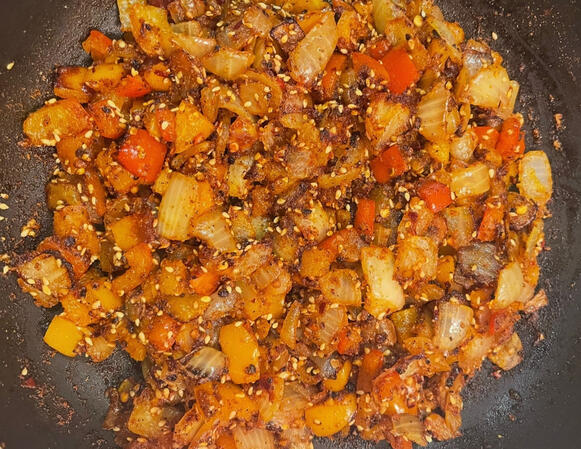 Sautéed peppers and onions with toasted sesame seeds