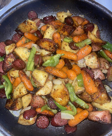 Beef kielbasa with carrots, potatoes, and peppers